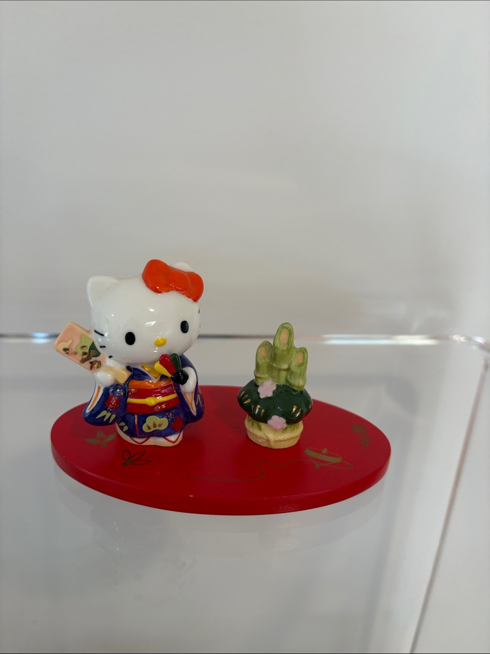 Hello Kitty Kimono Figurine with Red Base and Green Accent
